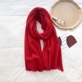 Vibrant red soft cashmere-feel scarf with short fringes on a minimalist backdrop - True Red