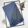 Light blue and grey dual-tone cashmere-style scarf with tassel fringe on marble background - Denim Blue and Grey