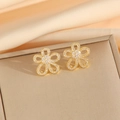 Golden flower earrings with micro-set cubic zirconia petals on champagne satin fabric - Gold Earrings