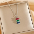 Rainbow gemstone necklace set with red green and blue rectangular stones on a jewelry box - Silver Necklace