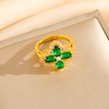 Macro detail of gold-plated clover ring featuring green emerald-like stones and crystals - Green Zircon Clover Ring (Adjustable Open) (8460)