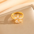 Macro shot of gold adjustable ring featuring sparkling marquise and round zircon stones - Gold Ring