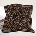 Silk square scarf featuring black and gold geometric patterns in a satin finish - Geometric F Logo Style