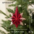 Red and gold glitter star ornament hanging on a Christmas tree with sizing details - Exploding Star