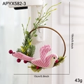 Pink striped bird wreath ornament with pine needles and red berries on a wooden ring - Pink Bird Wreath