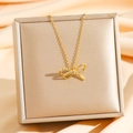 Elegante collana con fiocco dorato e micro-cristalli su una confezione regalo di lusso - Fiocco Pavé Oro (8586)