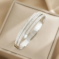 Elegant silver-toned wrap bracelet featuring triple-row pave crystals and white inlay detail - Silver (SZ7)