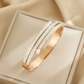 Sparkling rose gold titanium steel cuff bracelet with triple-row crystal inlays for women - Rose Gold (SZ7)