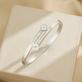 Zilveren klaver armband met pavé zirkoon en witte emaille afwerking - Zilver