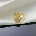 Adjustable gold plated bunny ring with white zircon flowers on white fabric backdrop - Rotatable Bunny Open Ring