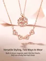 Detalle macro del collar magnético oro rosa que muestra formas de corazón y trébol - Oro rosa