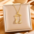Gouden bikini hanger ketting met zirkonia steentjes in een luxe geschenkverpakking - Gouden Bikini Top (8865 Gouden Ondergoed)