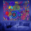 Macro shot of fluorescent UV psychedelic mandala tapestry with peace sign and guitar detail - Pop Art Guitar & Butterfly