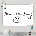 Detail of white fabric tapestry featuring Have a Nice Day print and smiley face design - 95x73cm / Simple Smiley Face Text