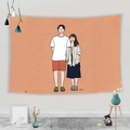 Detail of warm orange tapestry with minimalist couple line art hanging on white wall - 95x73cm / Warm Orange Couple Illustration
