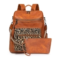 Detail view of brown faux leather backpack set with leopard print pocket and woven strap - Brown with Leopard