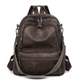Detail view of dark brown vintage texture backpack with multi-pocket design and stripe strap - Two-tone Coffee