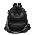 Detail of black leather backpack with silver zippers and striped woven shoulder strap - Black