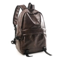 Detail view of dark brown faux leather backpack with metallic buckle and wide shoulder straps - Brown