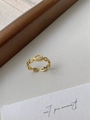 Detail of adjustable gold-tone chain ring featuring a teardrop zircon on white leather - Gold Chain Water Drop Zirconia Ring / Gold