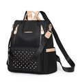 Black quilted backpack with golden rivets and khaki leather accents for women - Black