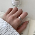 Bamboo style silver ring with zircon inlay worn on finger over minimalist background - Adjustable / Silver