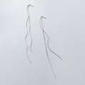 Minimalist silver wavy drop earrings with sleek long lines in a polished metallic finish - White Gold Plated Copper