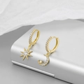 Elegant asymmetrical gold hoop earrings with sparkling star and moon crystal charms - Gold Pave Zirconia Asymmetric Star Moon