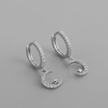 Macro detail of S925 sterling silver star and moon earrings with pavé cubic zirconia - Moon Star Zircon Hoops Silver