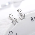 Detail shot of asymmetric star drop earrings with sparkling pavé cubic zirconia in silver - Hollow Pave Star Hoop Buckle