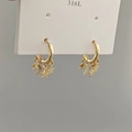 Detail of 316L stainless steel gold hoop earrings with star and moon charms - Moon Star Tassel Earrings - Gold