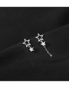 Macro shot of silver asymmetric star earrings with sparkling crystals on black fabric - Asymmetric Star Stud Earrings Silver
