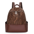 Chic women's patchwork backpack in caramel brown textured faux leather on white backdrop - Brown