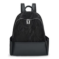Minimalist black backpack with textured fabric and smooth matte leather panel contrast - Black