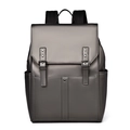 Front detail of dark grey leather backpack featuring magnetic buckle straps and pockets - Champagne