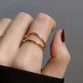 Elegant gold double layer wavy minimalist ring with polished finish on a finger - Adjustable Open / Gold