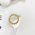 Close-up of polished gold beaded open ring on minimalist white and acrylic display - Adjustable Open / Gold Bead Style (S-R867)
