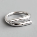Minimalist double layered wrap ring with a polished silver mirror finish on a smooth surface - Adjustable Open / Silver