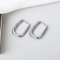 Detailed view of polished silver-tone U-shaped geometric earrings with a sleek mirror finish - Silver