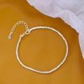 Macro shot of silver sparkling double-layer bracelet with adjustable clasp detail - Starry Chain Bracelet