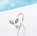 Detailed view of leaf-shaped ring with green cat eye stone on white surface - Adjustable Open / Green Leaf Ring