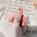 Detailed shot of an adjustable silver ring featuring a zircon stone and the letter N - Letter N