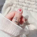 Close-up of adjustable silver ring featuring a letter S with crystal and a round solitaire - Letter S