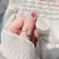 Detailed view of silver open ring featuring a T-shape design with sparkling pavé crystals - Letter T
