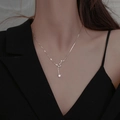 Detail of silver Big Dipper necklace with star pendant and zircons on a model - Big Dipper Necklace-Platinum Color