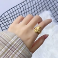 Detail of minimalist golden irregular lava ring with organic liquid metal texture - Organic Flowing Liquid Metal Style (385)