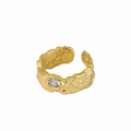 Macro shot of lava textured gold ring featuring a sparkling central zircon stone - Lava Texture With Zirconia Style (R1099)