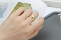 Chic gold wide ring with irregular lava texture worn on index finger for women - Wide Lava Irregular Texture Style (R579)