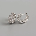 Macro shot of silver S925 chain link hoop earrings with micro-pave zircon crystals - Chain Link Zirconia Hoops - Platinum Color