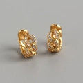 Detailed view of gold chain earrings with micro-set zircons on a gray background - Chain Link Zirconia Hoops - Gold Color